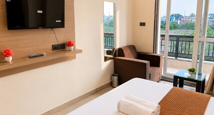 Hotel Pratishtha Room Type - Deluxe Room with Balcony Hotel Pratishtha Room Type - Deluxe Room with Balcony