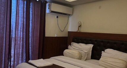 Icebergs | A Boutique Stay and 24 Hour Cafe Room Type - Deluxe Room with AC & Balcony