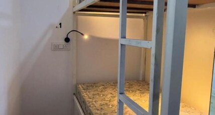 Half Orange Party Hostel by Pool side. Room Type - 4 Bed Female Dormitory