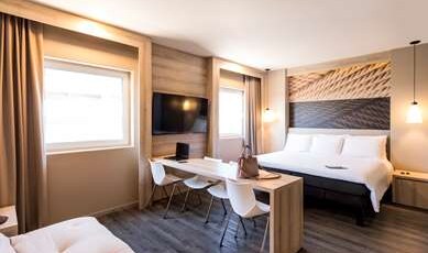 ibis Torreon Room Type - Suite with king-size bed, sofa bed, WIFI, LED TV, streaming, and bathroom