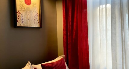 Mayuri Lodge Room Type - Small cozy cute room with big landscape mirror, Original artwork, fully carpeted