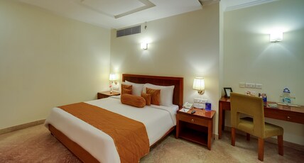 Royal Sarovar Portico Room Type - Deluxe King Bed