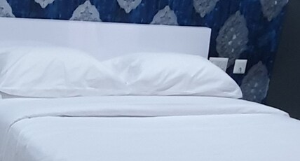 HOTEL NEW DREAMS INN Room Type - Deluxe Non AC Room