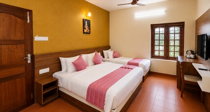 Madhura Residency | 6-Min Walk to Padmanabhaswamy Temple Room Type - Executive Deluxe Room
