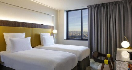 Pullman Paris Montparnasse Room Type - DELUXE ROOM, 2 single beds, view of Paris