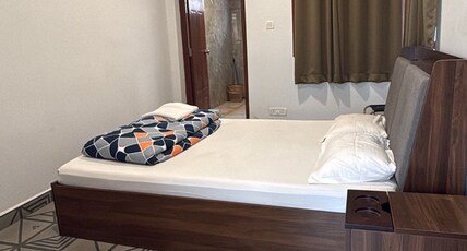 Half Orange Party Hostel by Pool side. Room Type - Deluxe Room