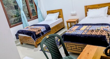 Naku homes dirang Room Type - Twin bed Room