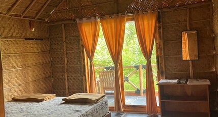 AMMASLE STAYS HAMPI AT RASTA CAFE. Room Type - Premium Bamboo Cottages