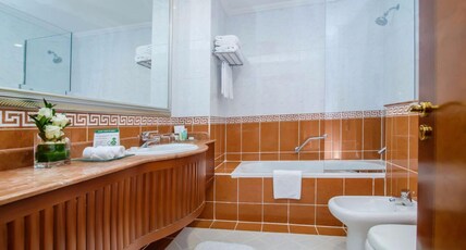 Grand Excelsior Hotel Bur Dubai Room Type - Executive One-Bedroom Suite with Bathub and Living area Grand Excelsior Hotel Bur Dubai Room Type - Executive One-Bedroom Suite with Bathub and Living area