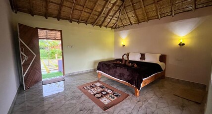 AMMASLE STAYS HAMPI AT RASTA CAFE. Room Type - Premium Room with paddy and mountain view