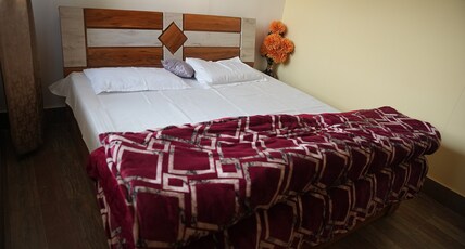 Divine Homestay Room Type - Deluxe Room