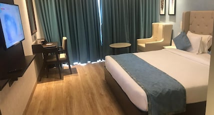 Enrise by Sayaji Rau(Indore) Room Type - Deluxe AC room with Balcony and King Bed Enrise by Sayaji Rau(Indore) Room Type - Deluxe AC room with Balcony and King Bed