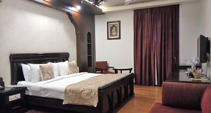 Hotel Rockland (Panchsheel Enclave) Room Type - Deluxe Suite with Couch and Work Desk
