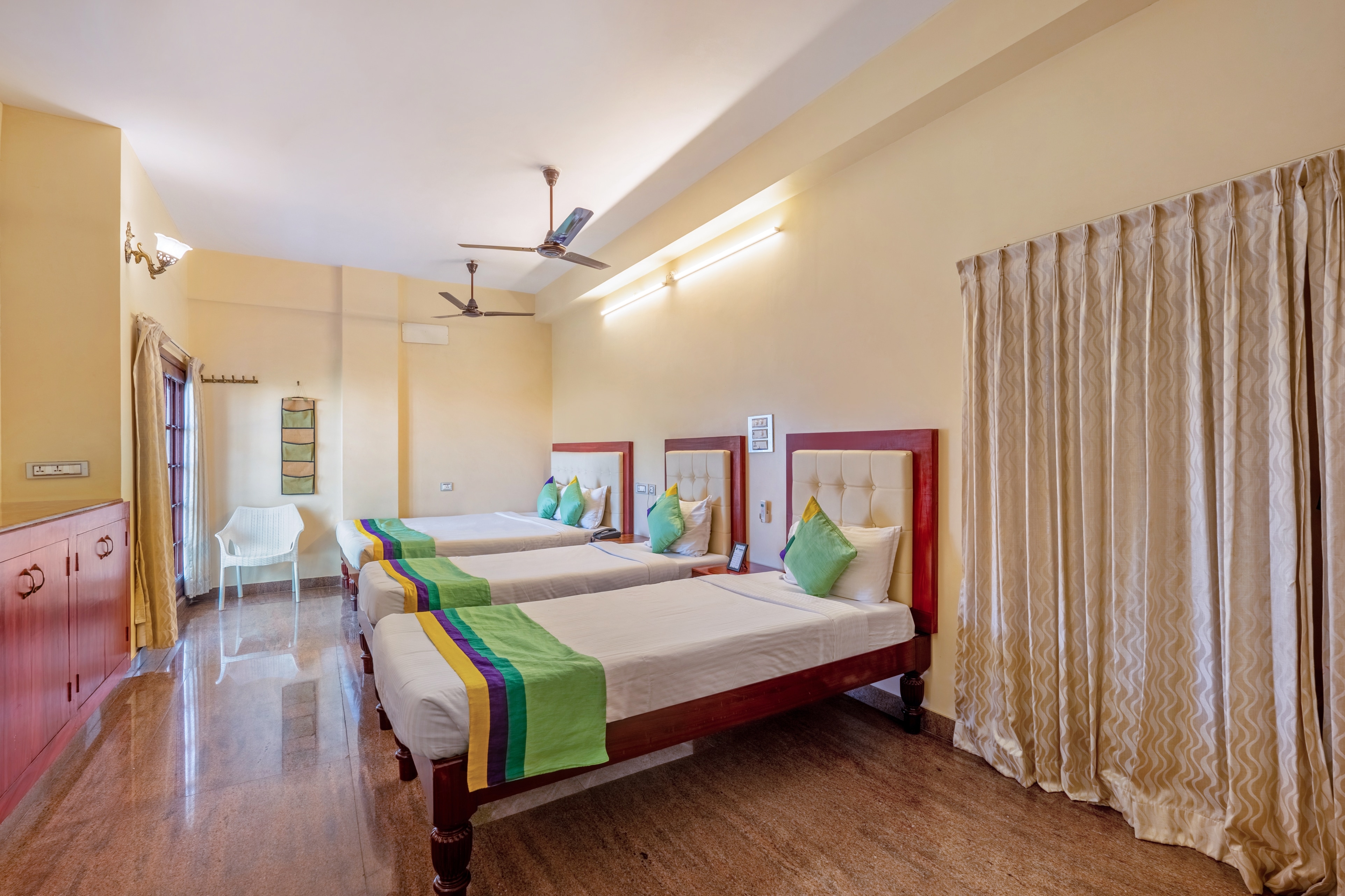 Treebo Grace Inn, 3 Min Walk From Promenade Beach - Tap to explore photos