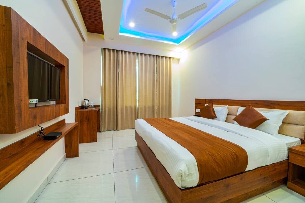 Hotel Divine Residency by VARSHRI - Tap to explore photos