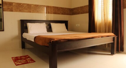 Kutralam Ezhilagam Hotel Room Type - Premium Family suite With Kitchen Non AC- Shenbagam (3 Bedrooms with 3 Bathrooms and 1 balcony)
