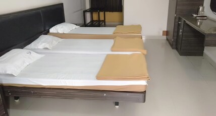 i-Roomz Hoysala Residency Room Type - Semi Deluxe Triple Bed Non AC