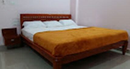 Shabari Residency Room Type - Deluxe Triple Room AC