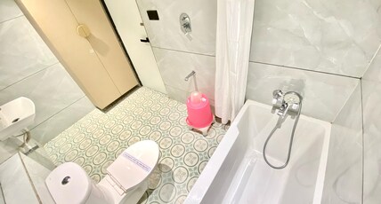 HOTEL RV RESIDENCY Room Type - Bathtub Round Bedroom