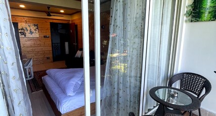 Titos homestays Room Type - Deluxe Room with Private Balcony