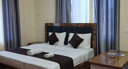 Raj Hotel Room Type - Deluxe Room with Balcony and RV View
