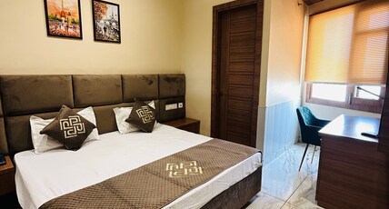 POOJA O DINE Room Type - Premium Deluxe Corner King Room