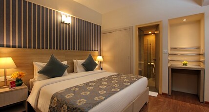 Starlit Suites Room Type - Deluxe Suite With Kitchenette Living Area and Balcony