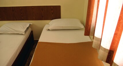 Hotel Sai Seva Inn Room Type - Four Bed Room Non A.C