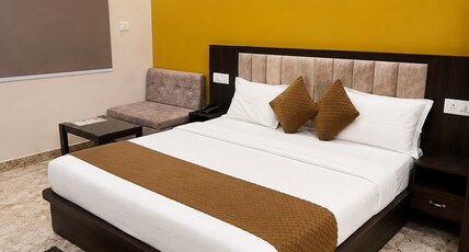 Shree Shubhgiri Inn Room Type - Deluxe King Bed Room