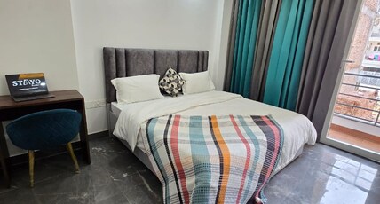 Stayo Suites Golf Course Road Room Type - King Suite 1BHK