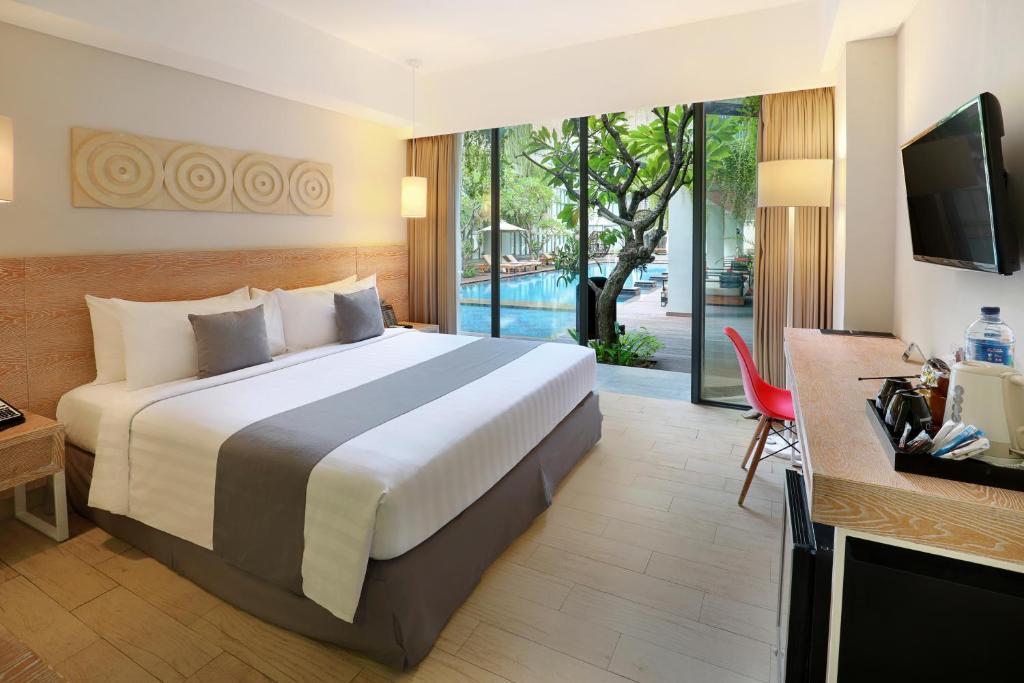 Hotel NEO Plus Kuta - Legian by ASTON - Tap to explore photos