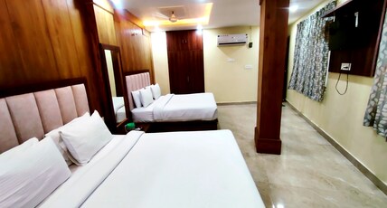 Hotel RN Residency Vrindavan Room Type - Family Room with Two Double Bed and Window Hotel RN Residency Vrindavan Room Type - Family Room with Two Double Bed and Window