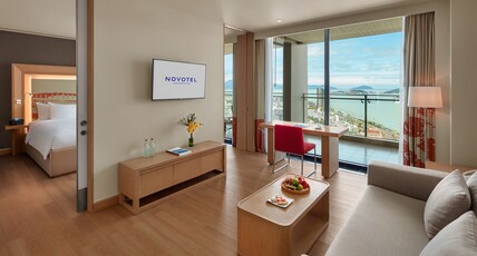 NOVOTEL DANANG PREMIER HAN RIVER Room Type - 2-Bedrooms Apartment, balcony, living room, kitchens, bathtub, 01 king bed and 2 single beds