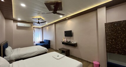 Hotel Pragya International Room Type - Deluxe Four Bed Room