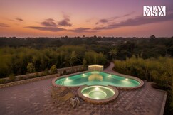 StayVista at Green Embrace - Swimming Pool, Rainshower, Terrace & Lawn