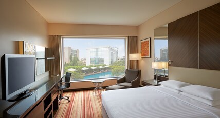 Courtyard by Marriott Mumbai International Airport Room Type - Deluxe King Room With Pool View Courtyard by Marriott Mumbai International Airport Room Type - Deluxe King Room With Pool View