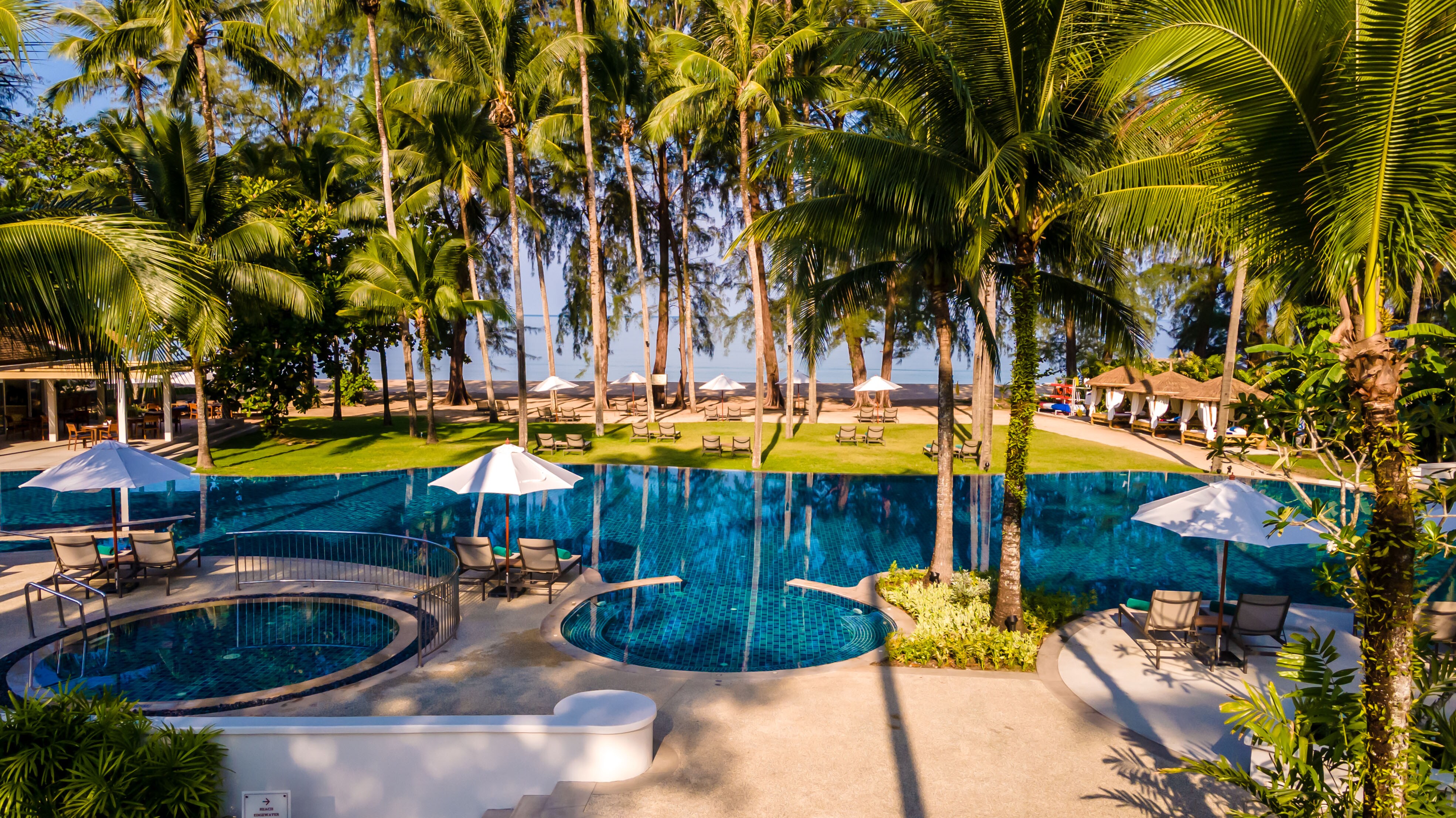 Outrigger Khao Lak Beach Resort - Tap to explore photos