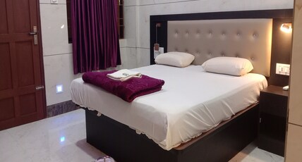 Thrivikrama Lodge Room Type - Deluxe Room AC