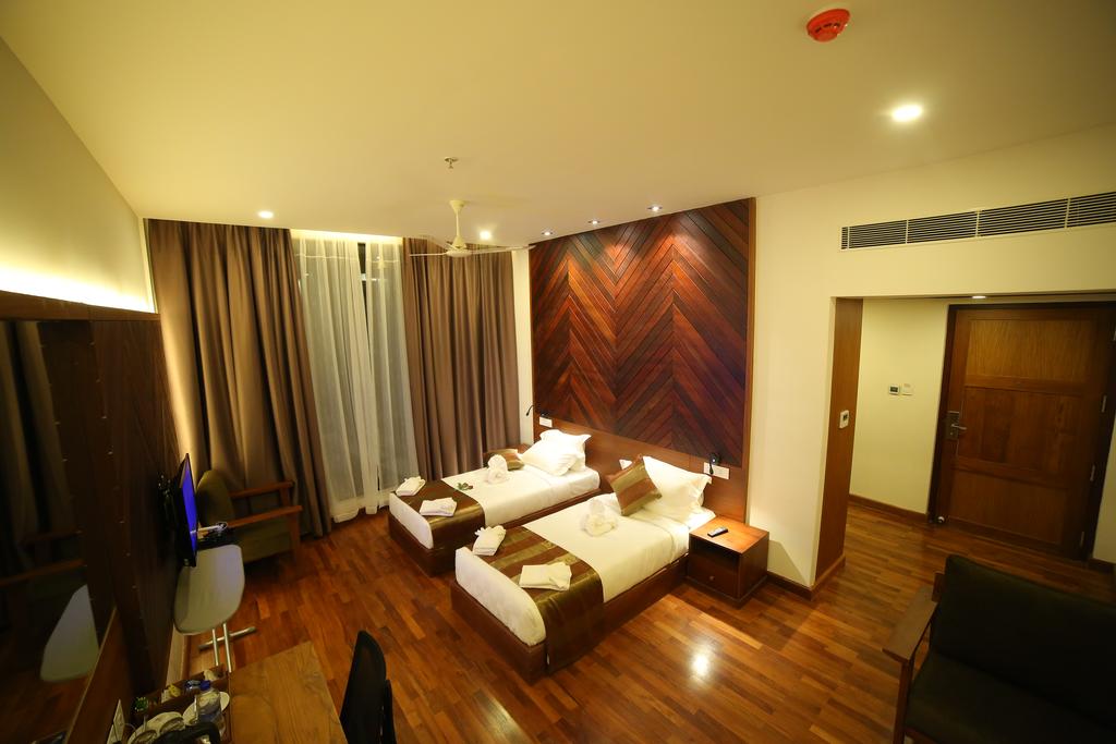 Woodies Bleisure Hotel - Tap to explore photos