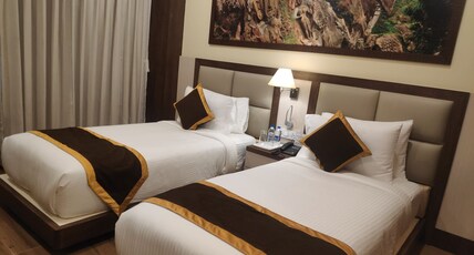Hotel Rimi International (800 m Away from Ujjayanta Palace) Room Type - Executive Room