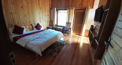 Wooden Umbrella Room Type - Double bedroom with garden view
