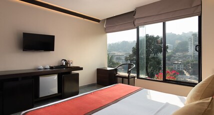 Oak Ray City Hotel Room Type - Deluxe Room