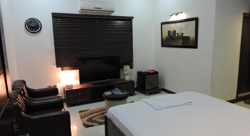 Hotel Dhanashree - Tap to explore photos