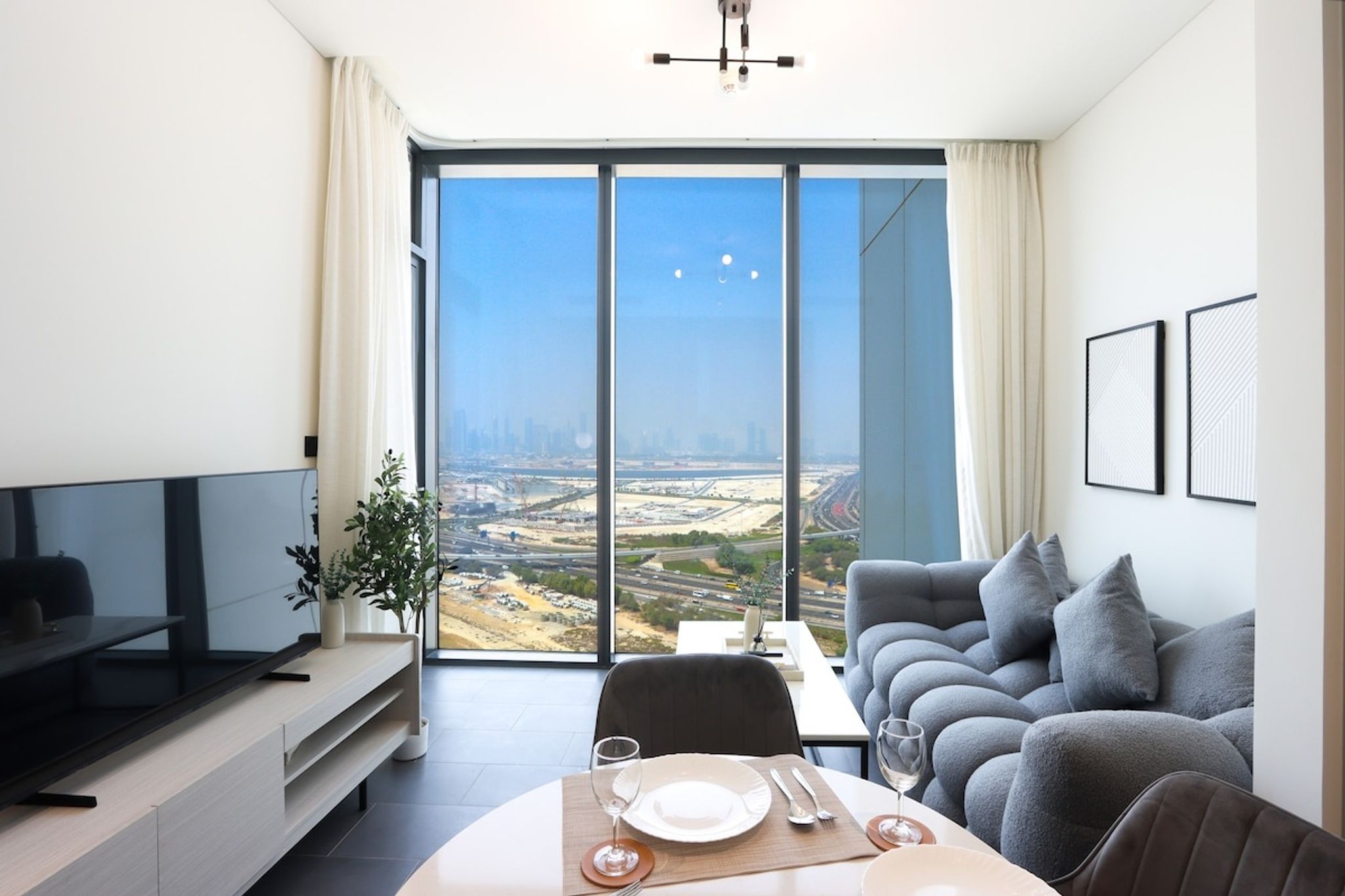 ELIVAAS Curated Stylish 1BR with Skyline Views | Sobha Crest - Tap to explore photos