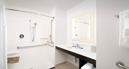 Holiday Inn Express & Suites - North Brunswick Room Type - 1 King Suite Communication Accessible Roll in Shower Holiday Inn Express & Suites - North Brunswick Room Type - 1 King Suite Communication Accessible Roll in Shower