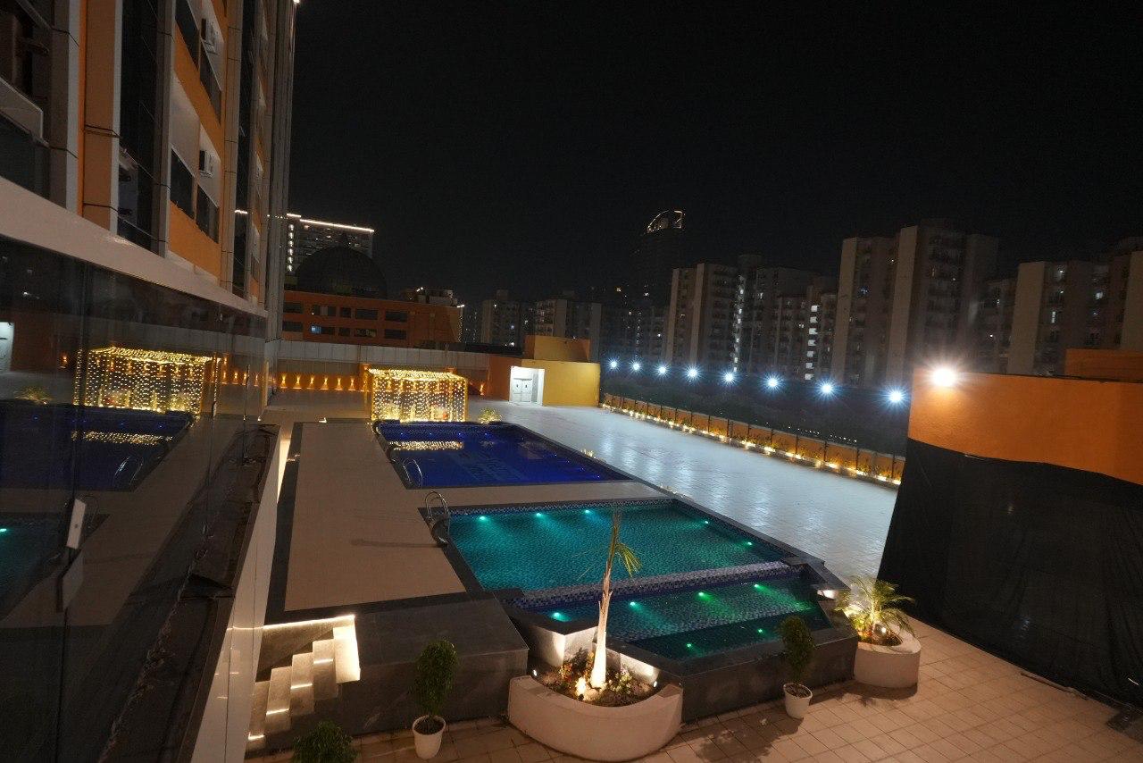Nimantrana Luxury Suites with Pool | 5 mins Walk from Sector 75 Metro - Tap to explore photos