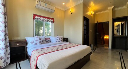 Chandralok's Villa Room Type - Deluxe Room with Garden View