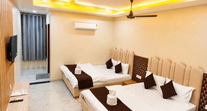Hotel Dinanath (Free Gated Parking & 10 Minutes Walk from Temple) Room Type - Family Room ( 2 Double Bed | 4 Pax ) Hotel Dinanath (Free Gated Parking & 10 Minutes Walk from Temple) Room Type - Family Room ( 2 Double Bed | 4 Pax )