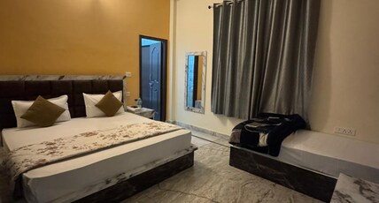 BHAGIRATHI RESIDENCY Room Type - Deluxe Room Triple Bed AC