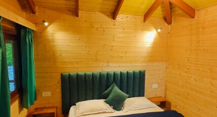 The Heimat Resort | River-view Tents Room Type - Garden view family wooden suite